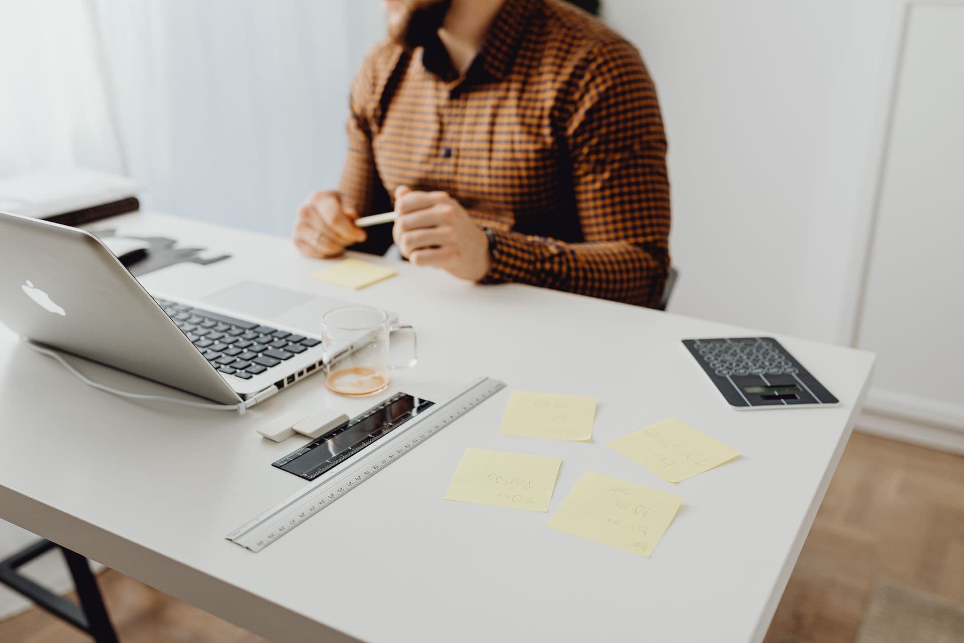 An entrepreneur working at a home office desk