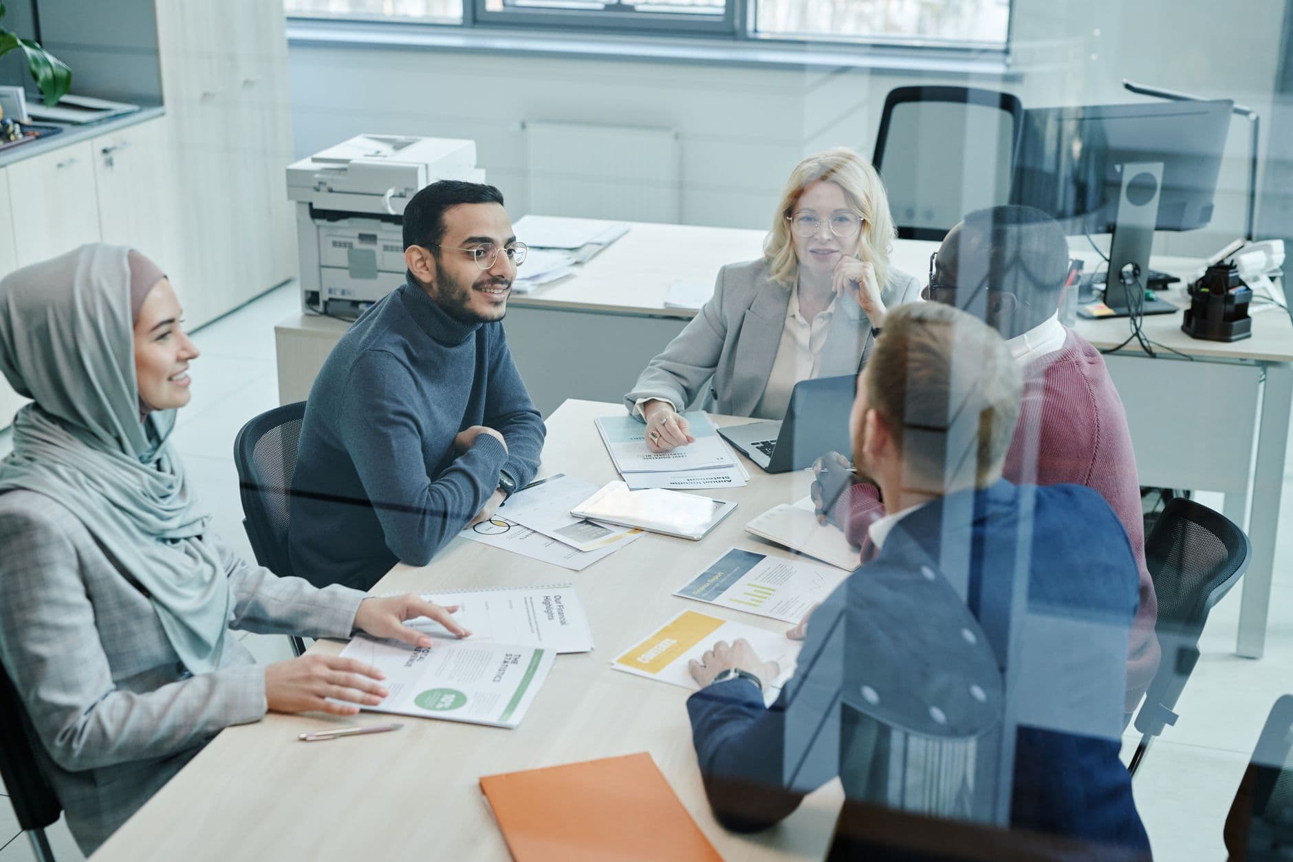A marketing team planning video content strategy around a table